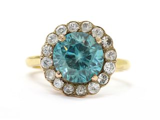 A gold blue zircon and white sapphire cluster ring,