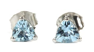 A pair of white gold single stone aquamarine stud earrings,