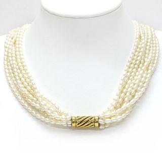 A seven row uniform cultured freshwater pearl necklace, with gold twist clasp,