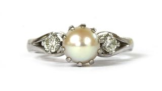 A white gold three stone cultured pearl and diamond ring,