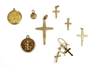 Four 9ct gold cross pendants,