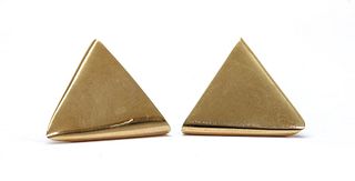 A pair of gold collar tips,