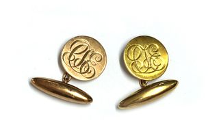 A pair of gold cufflinks,