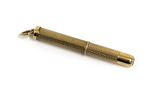 A 9ct gold propelling toothpick,