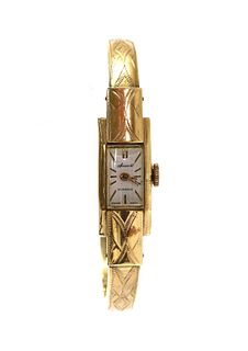 A ladies’ gold Accurist mechanical bangle watch,