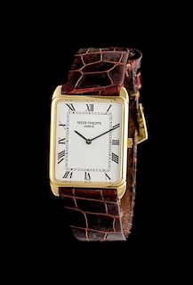 * An 18 Karat Yellow Gold Ref. 3803 Wristwatch, Patek Philippe,