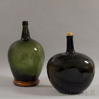 Two Olive Green Glass Demijohns