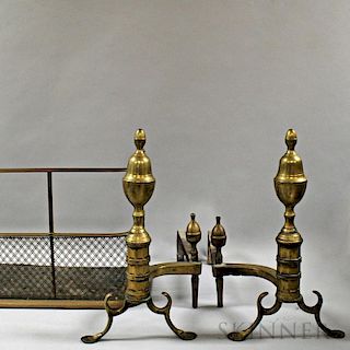 Pair of Brass and Iron Acorn-top Andirons and a Fireplace Fender