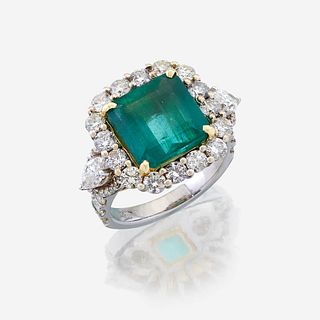 An emerald, diamond, and eighteen karat white gold ring