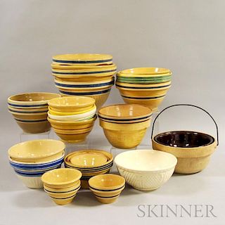 Twenty-six Mostly Yellowware Mixing Bowls