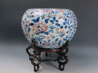 A Chinese Underglaze Blue And Copper Red Porcelain Jar with Wood Stand