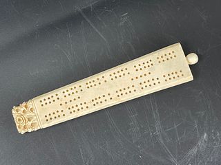 A Carved Bone Cribbage Board Contain Game