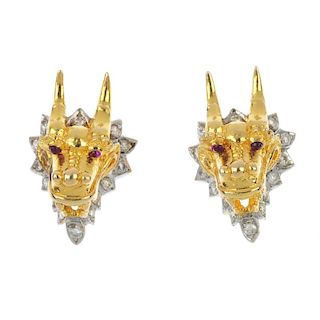 A pair of diamond dragon earrings. Each designed as a dragon head, with brilliant-cut diamond beard