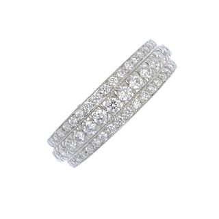 A diamond three-row dress ring. The brilliant-cut diamond line, raised to the similarly-cut diamond