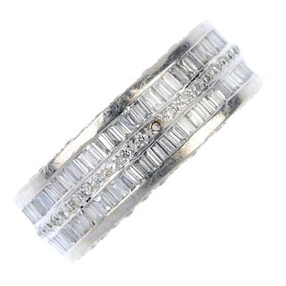 A diamond full-circle eternity ring. Thealternating baguette and brilliant-cut diamond lines, to the
