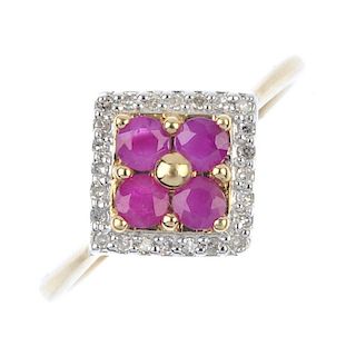 A 9ct gold ruby and diamond dress ring. The circular-shape ruby quatrefoil, within a single-cut diam