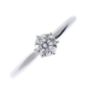 An 14ct gold diamond single-stone ring. The brilliant-cut diamond, to the plain band. Estimated diam
