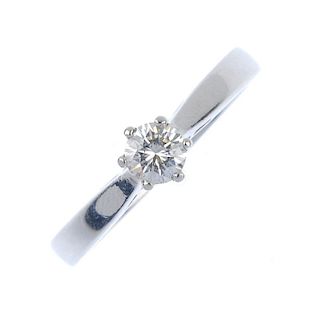 A platinum diamond single-stone ring. The brilliant-cut diamond, to the plain band. Diamond weight 0