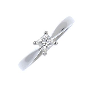 A platinum diamond single-stone ring. The square-shape diamond, to the plain band. Estimated diamond