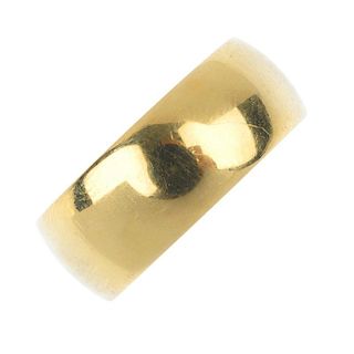 An 18ct gold band ring. Hallmarks for Birmingham, 1972. Width of band 7mms. Weight 8.6gms. <br><br>O