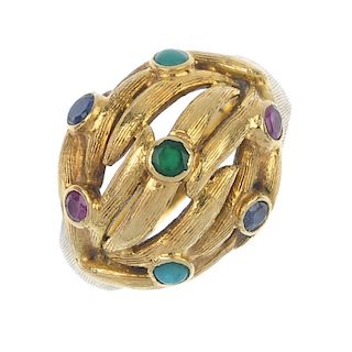 A multi-gem ring. Of bombe design, the entwined textured bars, inset with a series of gemstones, to