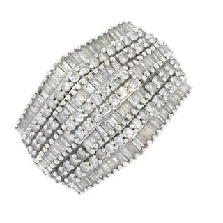 A 9ct gold diamond dress ring. Designed as a series of brilliant and baguette-cut diamond lines, to