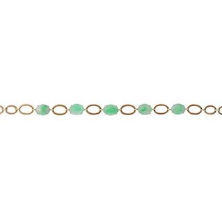 A jade bracelet. Comprising a series of five oval jade cabochons, with oval link spacers, to the pus