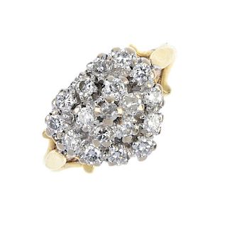 An 18ct gold diamond cluster ring. The brilliant-cut diamond stepped heart-shape cluster, to the tri