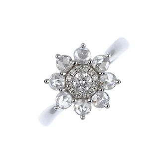 * A diamond cluster ring. The brilliant-cut diamond cluster within a rose-cut diamond surround, to t