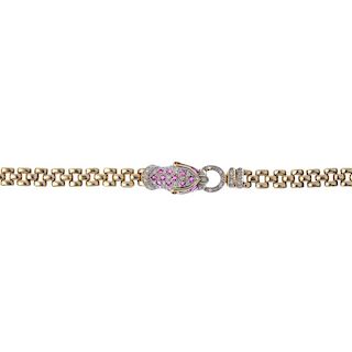 A 9ct gold diamond and ruby leopard bracelet. The front designed as a pave-set diamond and ruby leop