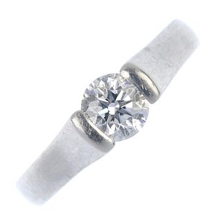 A platinum diamond single-stone ring. The brilliant-cut diamond, weighing 0.51ct, to the tapered ban