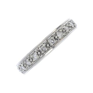 A 9ct gold diamond full-circle eternity ring. Designed as a brilliant-cut diamond line. Estimated to