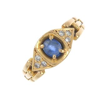 A sapphire and diamond ring. The oval-shape sapphire, with brilliant-cut diamond trefoil sides, to t