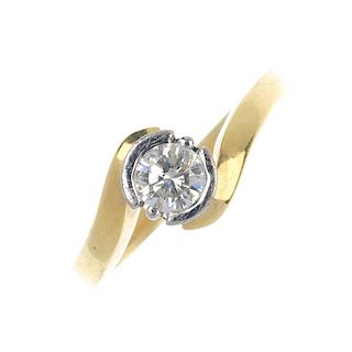 An 18ct gold diamond single-stone ring. The brilliant-cut diamond partial collet, to the crossover s