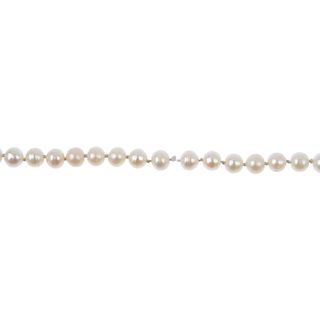 A cultured pearl single-strand necklace. Comprising a strand of sixty-eight oval-shape cultured pear