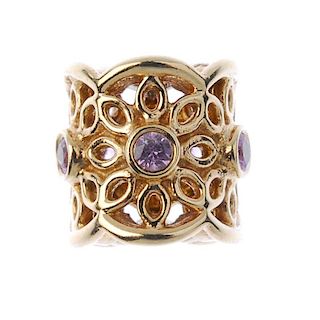 PANDORA - A 14ct gold sapphire charm. Designed as a series of pink sapphires within a openwork folia