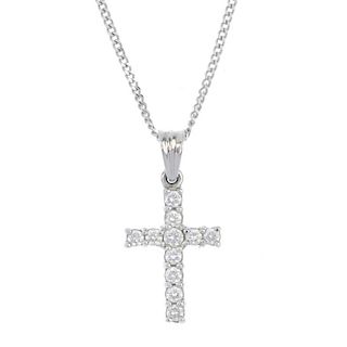 A platinum diamond cross pendant. The brilliant-cut diamond cross, to the tapered surmount, suspende