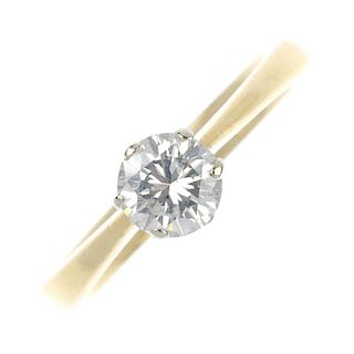 An 18ct gold diamond single-stone ring. The brilliant-cut diamond, to the tapered shoulders and plai