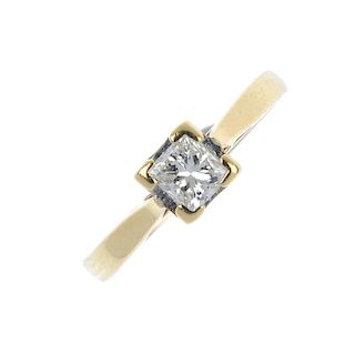An 18ct gold diamond single-stone ring. The square-shape diamond, to the tapered band. Estimated dia