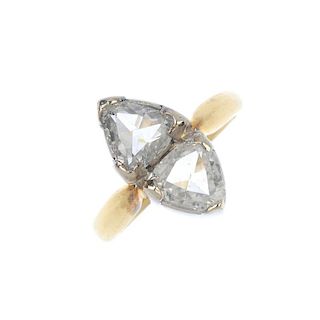 <p>An 18ct gold diamond two-stone ring. The triangular-shape rose-cut diamonds, to the plain band. T