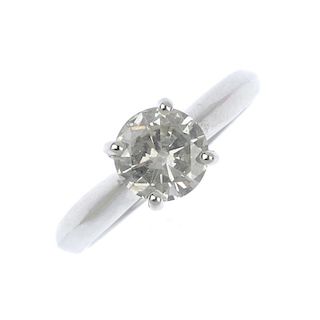 <p>An 18ct gold diamond single-stone ring. The brilliant-cut diamond, to the tapered shoulders and p