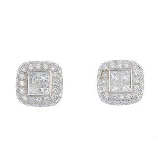 A pair of 18ct gold diamond cluster ear studs. Each designed as four square-shape diamonds, within a