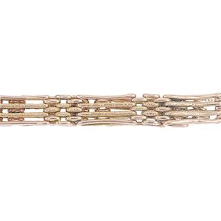 An early 20th century 9ct gold gate-link chain. The partially textured four-bar gate-links, to the p