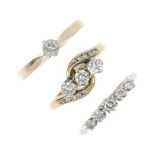 A selection of three 9ct gold diamond rings. To include a brilliant-cut diamond crossover ring with