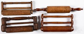 Four antique wood rolling pins.