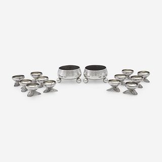 A pair of Néo-Grec sterling silver master salts and a set of twelve silver salt cellars with lily pad feet Tiffany & Co., New York, NY, 1875-1891, and