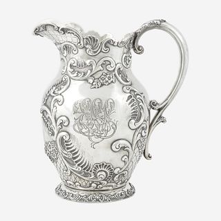 A sterling silver repoussé water pitcher Retailed by Bailey Banks & Biddle, Philadelphia, PA, late 19th century