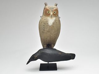 Rare Herter's owl with mounted dead crow, Herter's Factory, Waseca, Minnesota, circa 1950.