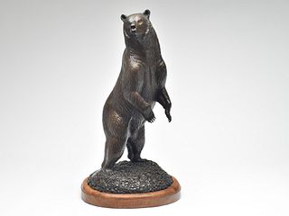 Bronze of a grizzly bear standing on small stones, Gerald George Balciar (b.1942).