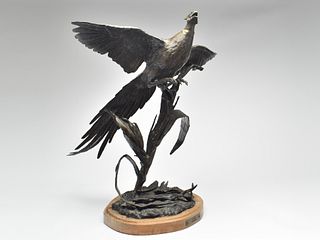 Bronze of full size pheasant, rising out of corn field, Carl Wagner (1938-2011).